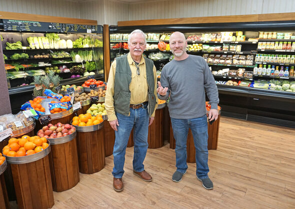 The apple doesn’t fall too far in the Gray family. After 57 years of working in Yellow Springs’ downtown grocery — first when it was Luttrell’s, then Weaver’s and later as his own Tom’s Market — proprietor Tom Gray is retiring. Taking over is Gray’s youngest son, Jeff Gray. A village native, Jeff Gray recently moved back to town from Phoenix, Ariz., to take his father’s reins at the store. (Photo By Reilly Dixon)